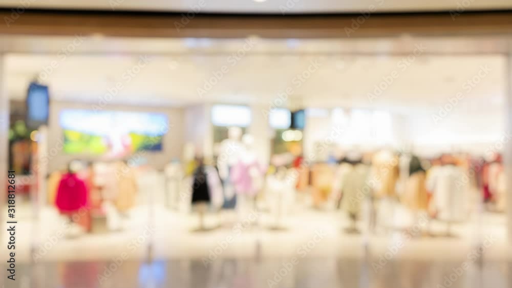 Abstract Blurred background, blur display clothing store in shopping mall with bokeh light, defocused shopping mall in department store for Fashion business backdrop.