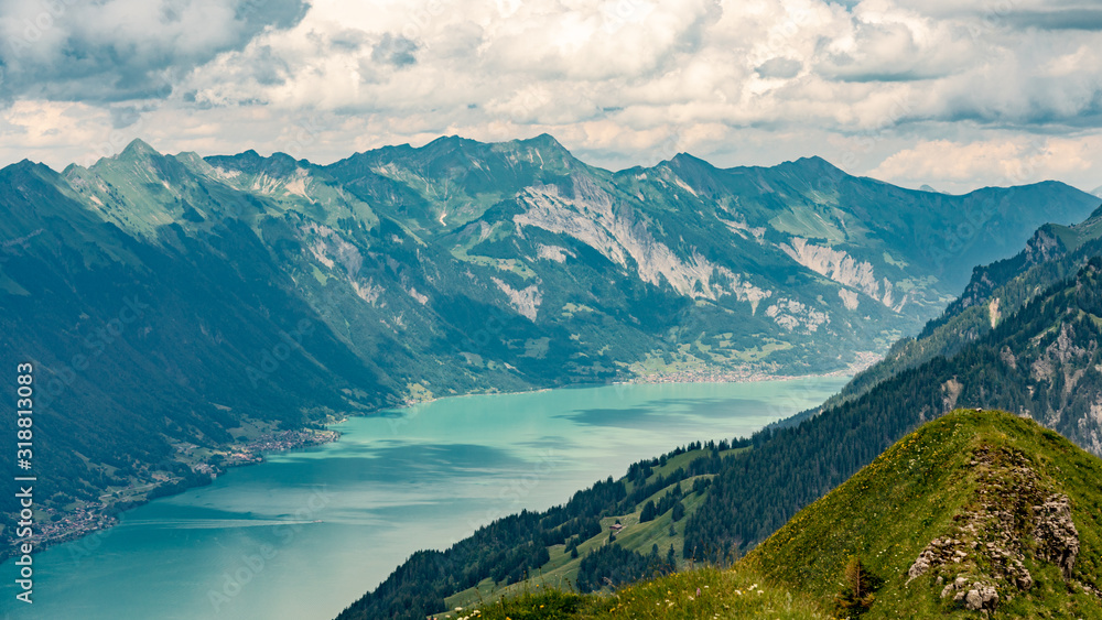 Switzerland, Panoramic view on green Alps and lake Brienzersee  from Saxeten valley