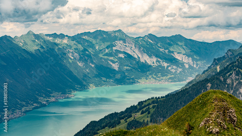 Switzerland, Panoramic view on green Alps and lake Brienzersee from Saxeten valley