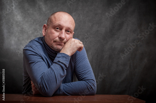 Slika na platnu portrait of a middle-aged man on a dark background. reverie