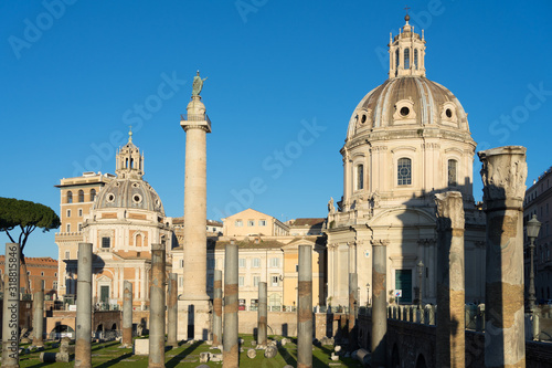Rome, Italy - Dec 31, 2019: Trajan's Column (UNESCO World Heritage Site) in Trajan's Forum and church of Santa Maria di Loreto, Rome, Lazio, Italy