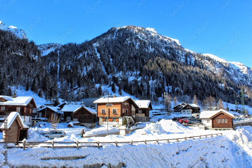 SNOW COVERED HOUSES AND BUILDINGS AGAINST SKY - obrazy, fototapety, plakaty 