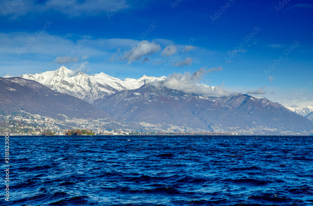 Alpine Lake Maggiore with Brissago Islands and Snow-capped Mountain in Ticino, Switzerland.