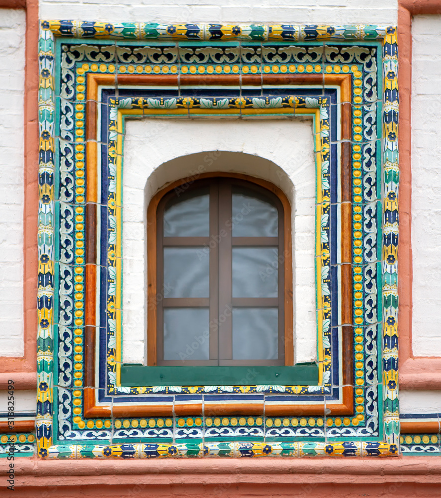 Fragment of ancient colored tiles on the rector’s building of the Iversky monastery. Novgorod region. Valdai district. Selwicki Island. Russia