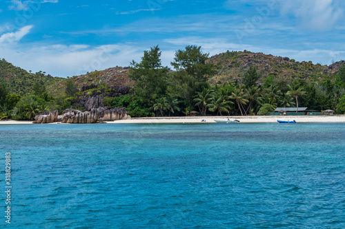 The coastline white sand beach of the island of Curieuse, Seychelles