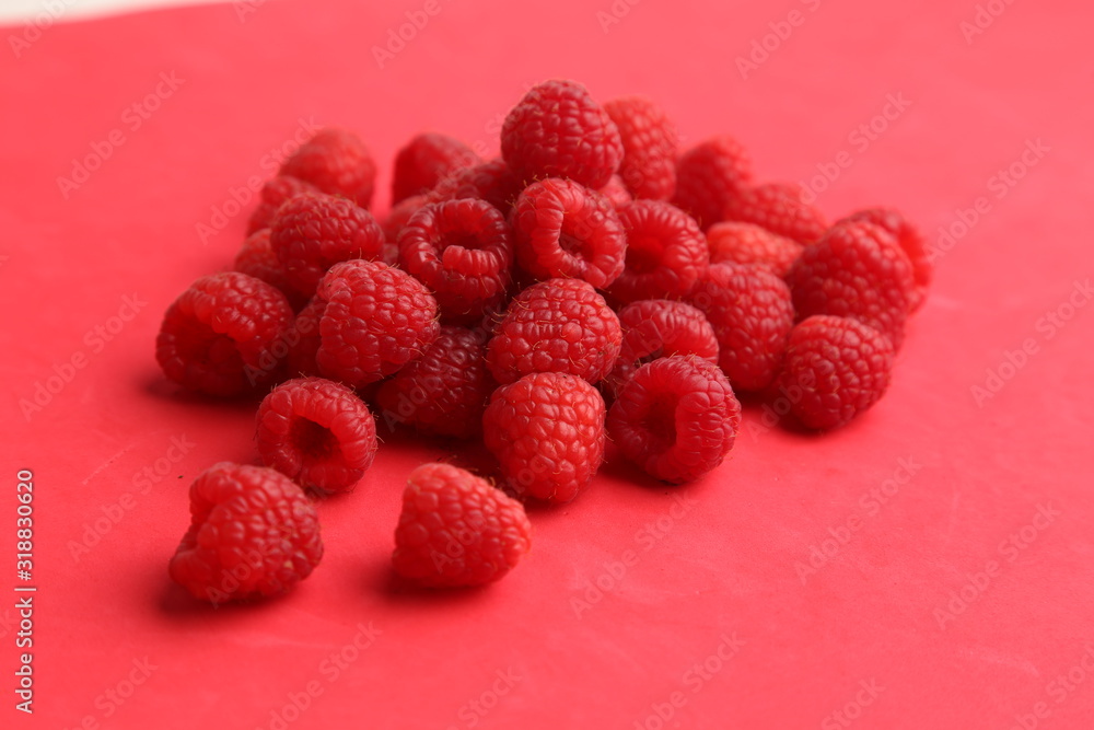 delicious raspberries in colorful background delicious raspberries in colorful background