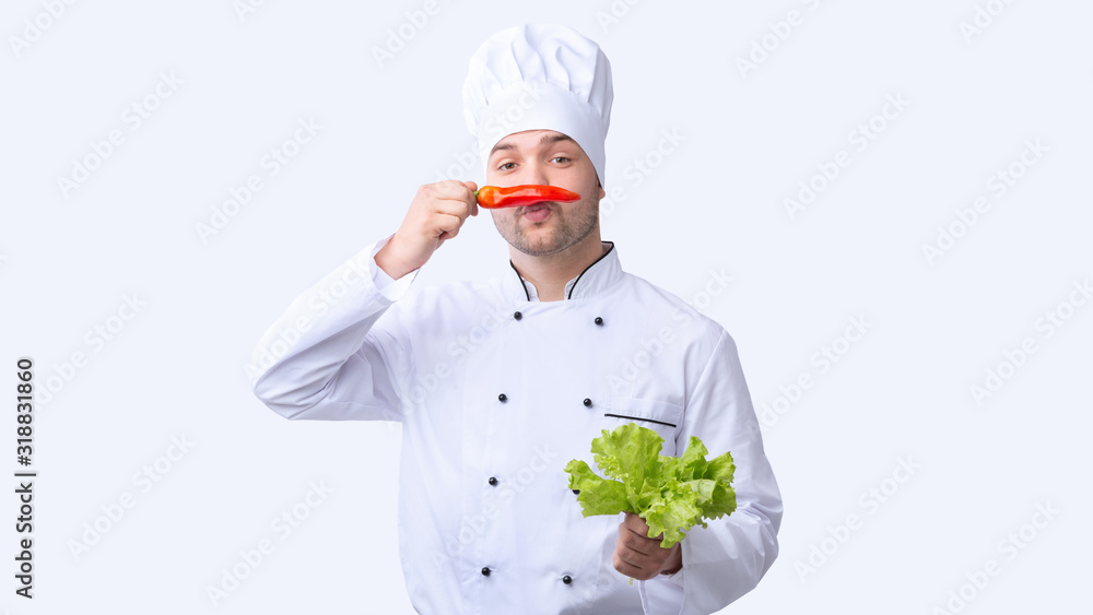 Funny Chef Man Holding Red Pepper Like Moustaches, Studio Shot Funny Chef Man Holding Red Pepper Like Moustaches, Studio Shot