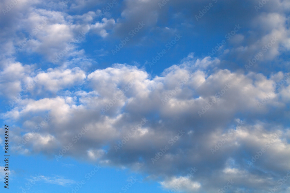 Beautiful white clouds on the natural background of the blue sky Beautiful white clouds on the natural background of the blue sky