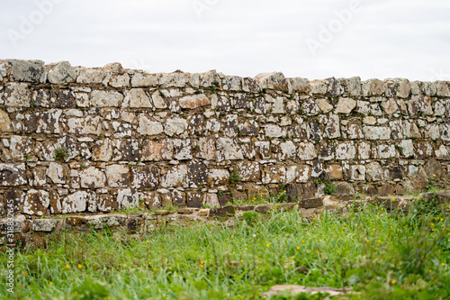 Ruins of a stone wall of the Aljezur Castle in the Algarve region of Southern Portugal