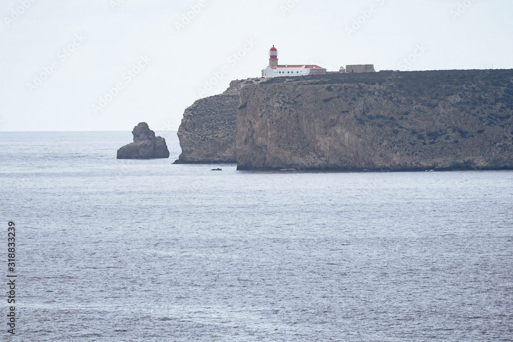 Lighthouse at the Cabo De Sao Vicente in Sagres in Algarve Portugal on overcast day