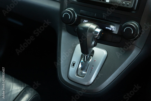 Put a gear stick into P position, (Parking) Symbol in auto transmission car.