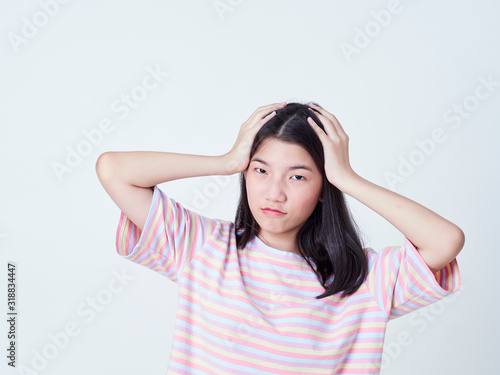 Teenage girl suffering from headache.