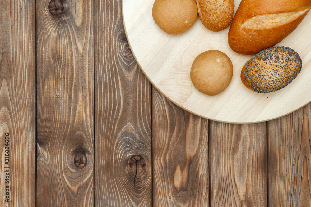 Buns on a plate on a wooden background
