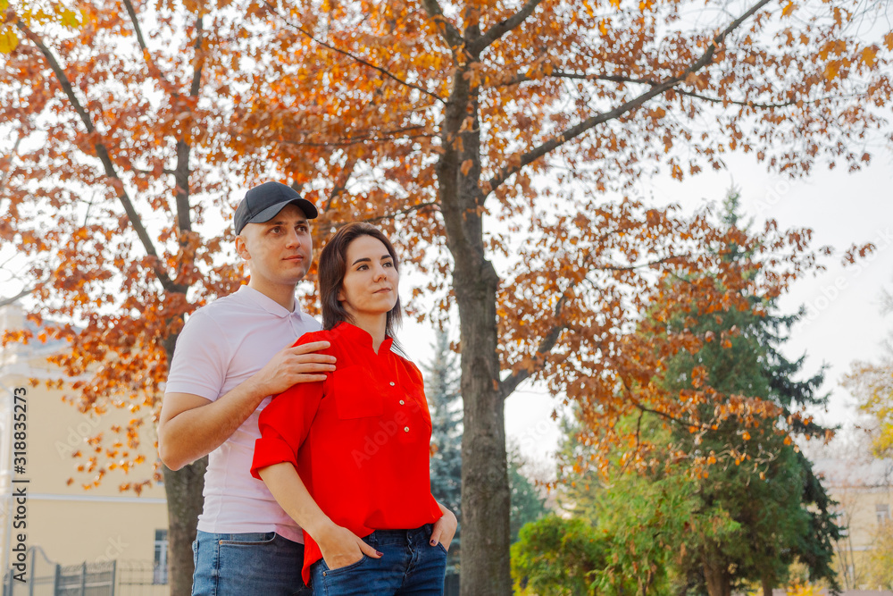 Happy couple in love on a background of yellow leaves in autumn. Happy couple in love on a background of yellow leaves in autumn.