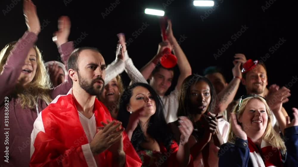 Football / Soccer fans or supporters Clapping / Applause - having a great time at a match. Slow motion. Stock Video clip footage Football / Soccer fans or supporters Clapping / Applause - having a great time at a match. Slow motion. Stock Video clip footage