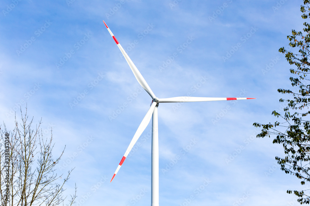 Wind turbine with a blue sky in the background