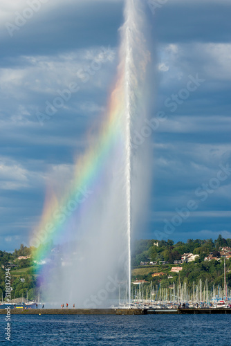 Beautiful view of the water jet fountain with rainbow in the lake of Geneva, Switzerland