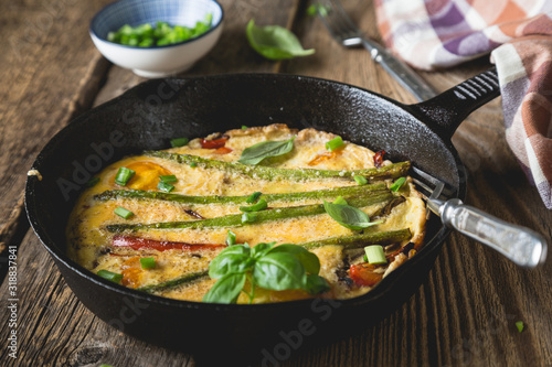 Frittata. Italian omelet with asparagus and bell pepper