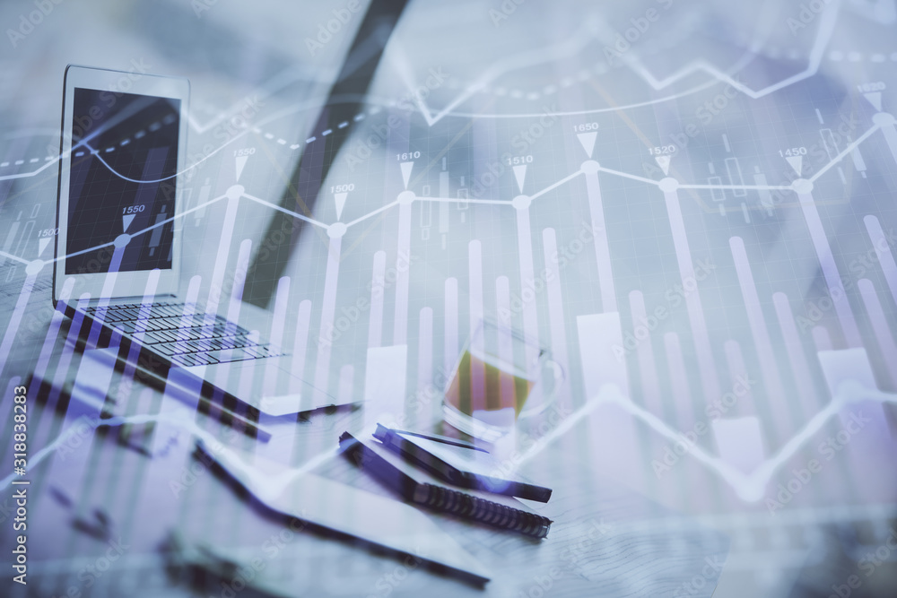 Forex graph hologram on table with computer background. Multi exposure. Concept of financial markets. Forex graph hologram on table with computer background. Multi exposure. Concept of financial markets.