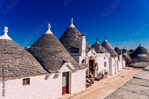 Houses of the tourist and famous Italian city of Alberobello, with its typical white walls and trulli conical roofs. © Joaquin Corbalan