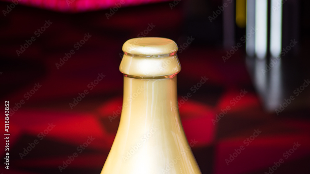 Golden Bottleneck of a champagne. Bottle on gradient grey background Golden Bottleneck of a champagne. Bottle on gradient grey background