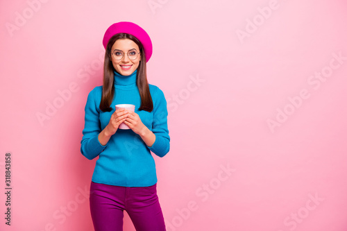 Portrait of cheerful dreamy girl have rest relax breakfast hold mug hot beverage latte wear good looking outfit isolated over pastel pink color background