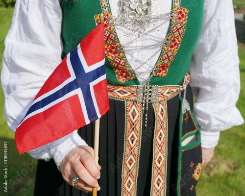 Fototapeta Midsection Of Woman Wearing Traditional Clothing While Holding Norwegian Flag