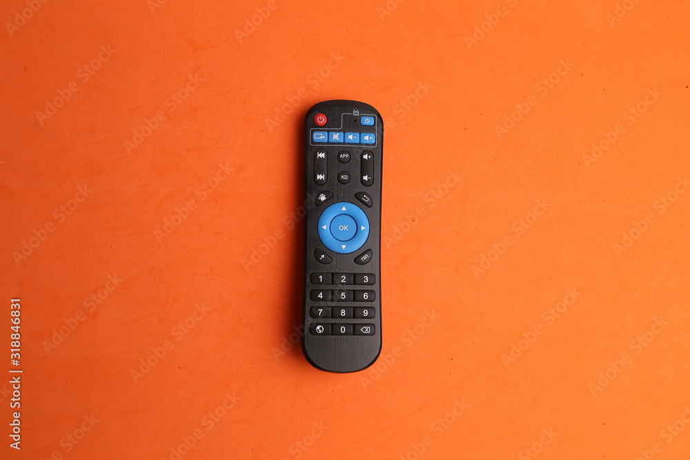 TV remote control in color background