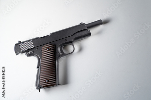 Big black gun pistol on white background.
