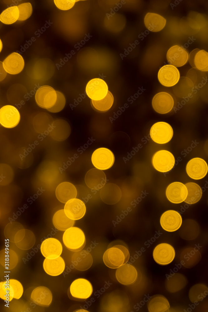 Defocused of blurred golden bokeh circle light from lighting bulb in the night for abstract background texture