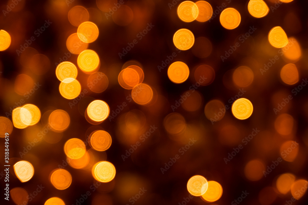 Defocused of blurred golden orange bokeh circle light from lighting bulb in the night for abstract background texture Defocused of blurred golden orange bokeh circle light from lighting bulb in the night for abstract background texture