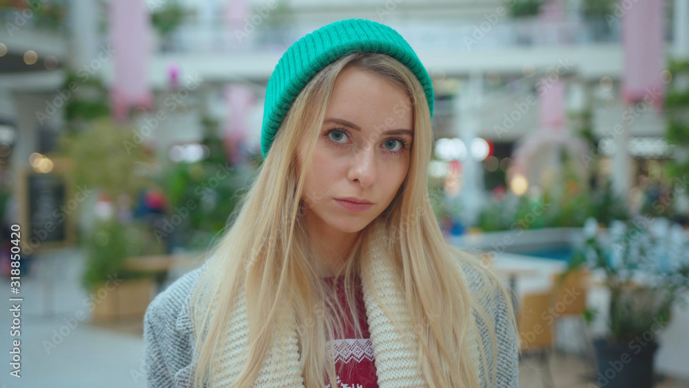 Serious face young beautiful woman wear green hat look at camera fashion Christmas holidays attractive winter model person casual portrait slow motion Serious face young beautiful woman wear green hat look at camera fashion Christmas holidays attractive winter model person casual portrait slow motion