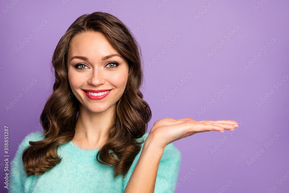 Closeup photo of pretty wavy lady hold open arm advising novelty product low shopping price wear casual teal fluffy pastel pullover isolated purple color background Closeup photo of pretty wavy lady hold open arm advising novelty product low shopping price wear casual teal fluffy pastel pullover isolated purple color background