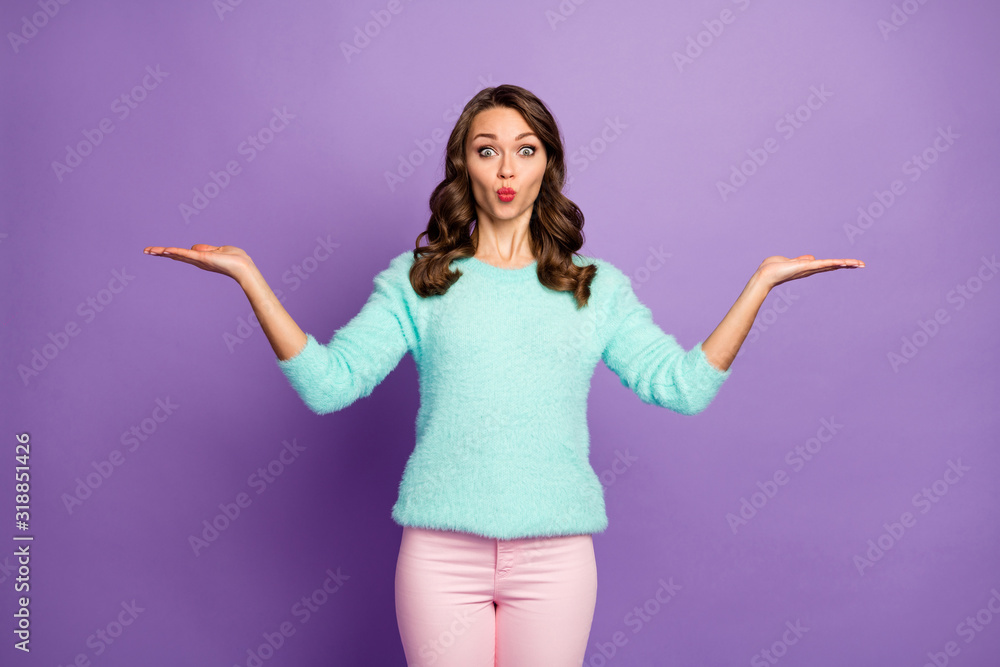Photo of beautiful wavy lady hold open arms advising low shopping prices novelty products send air kiss wear casual teal fluffy sweater pink pants isolated pastel purple color background Photo of beautiful wavy lady hold open arms advising low shopping prices novelty products send air kiss wear casual teal fluffy sweater pink pants isolated pastel purple color background