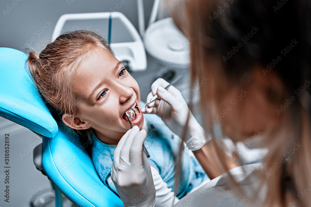 Close-up view medical dentist procedure of teeth polishing with clean Close-up view medical dentist procedure of teeth polishing with clean