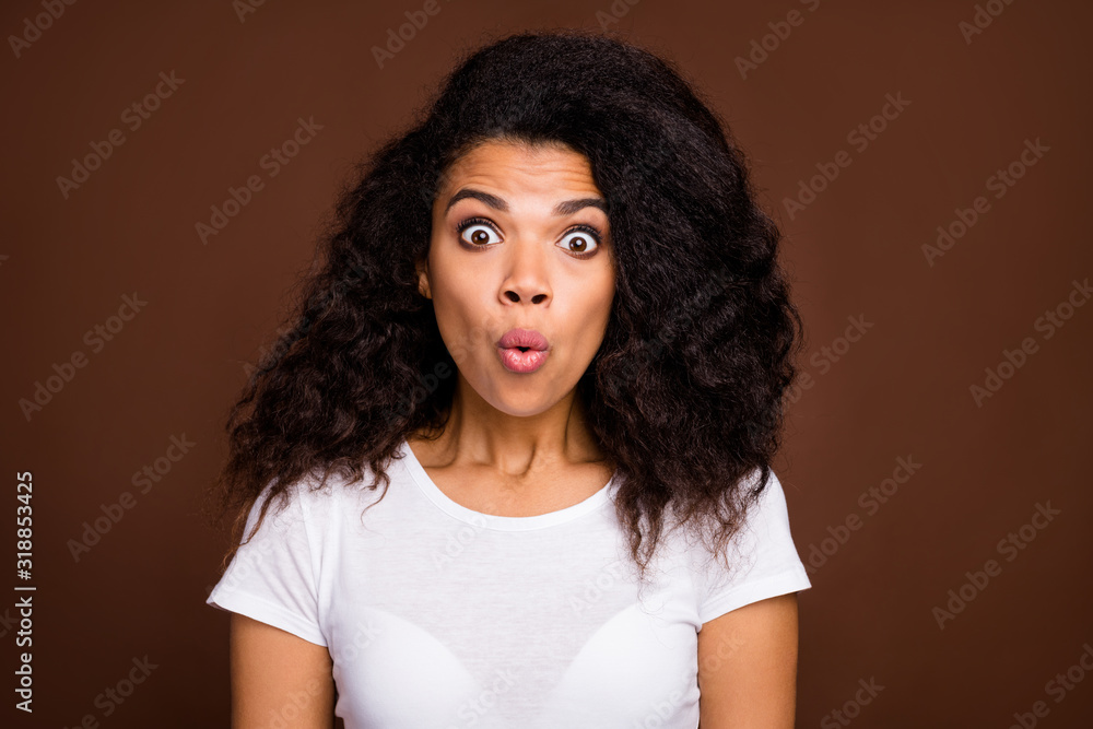 Close up photo of astonished afro american girl hear news wonder stare stupor wear casual style outfit isolated over brown color background Close up photo of astonished afro american girl hear news wonder stare stupor wear casual style outfit isolated over brown color background