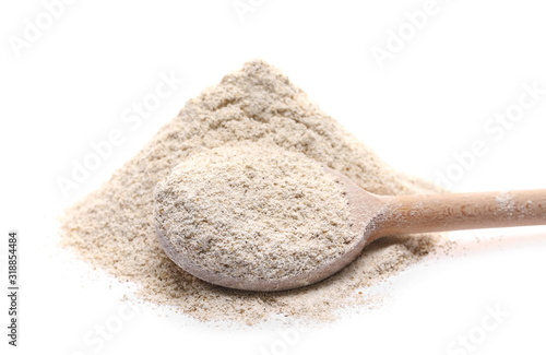 Barley flour with wooden spoon isolated on white background