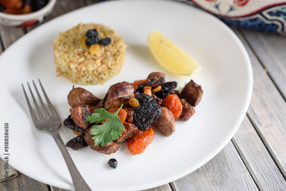 Turkish Lamb Meat, Dried Fruit and Almond Stew with Bulgur as Side Dish, Kuzu Mutancana. Turkish Lamb Meat, Dried Fruit and Almond Stew with Bulgur as Side Dish, Kuzu Mutancana.