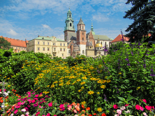 Wavel Castle in Krakow with colourful flowers on foreground.