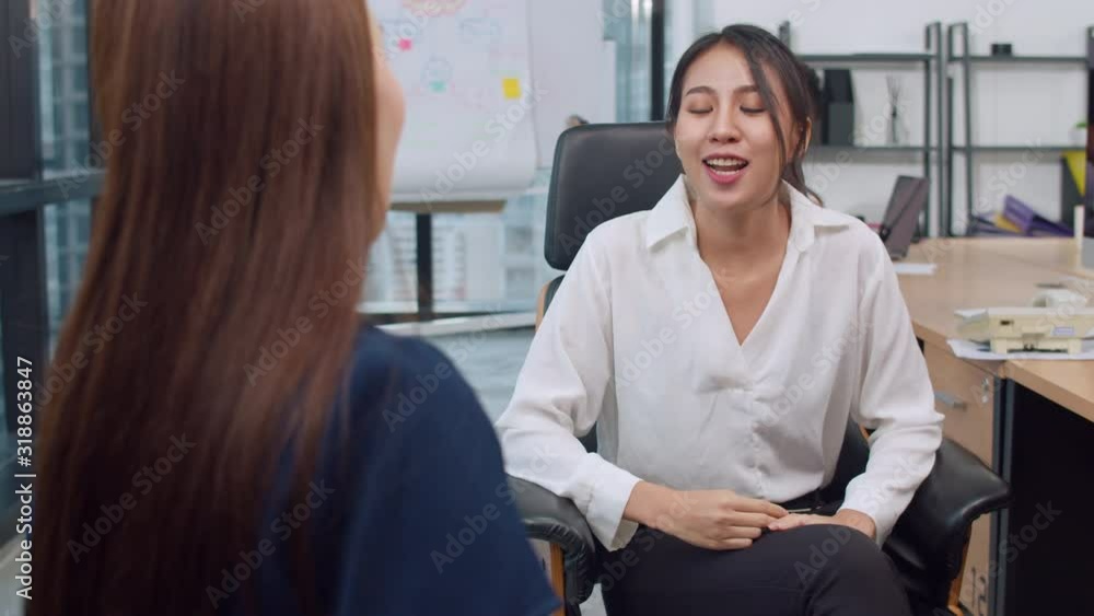 Asia businesspeople chatting to intern discussing job interview colleagues having conversation and meeting brainstorming ideas about project working plan success strategy in office. 4k Slow motion. Asia businesspeople chatting to intern discussing job interview colleagues having conversation and meeting brainstorming ideas about project working plan success strategy in office. 4k Slow motion.