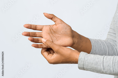 Close up of woman hand with numb finger syndrome photo