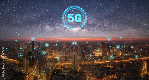 5G network digital hologram and internet of things on city background.5G network wireless systems.concept of high speed internet signal network