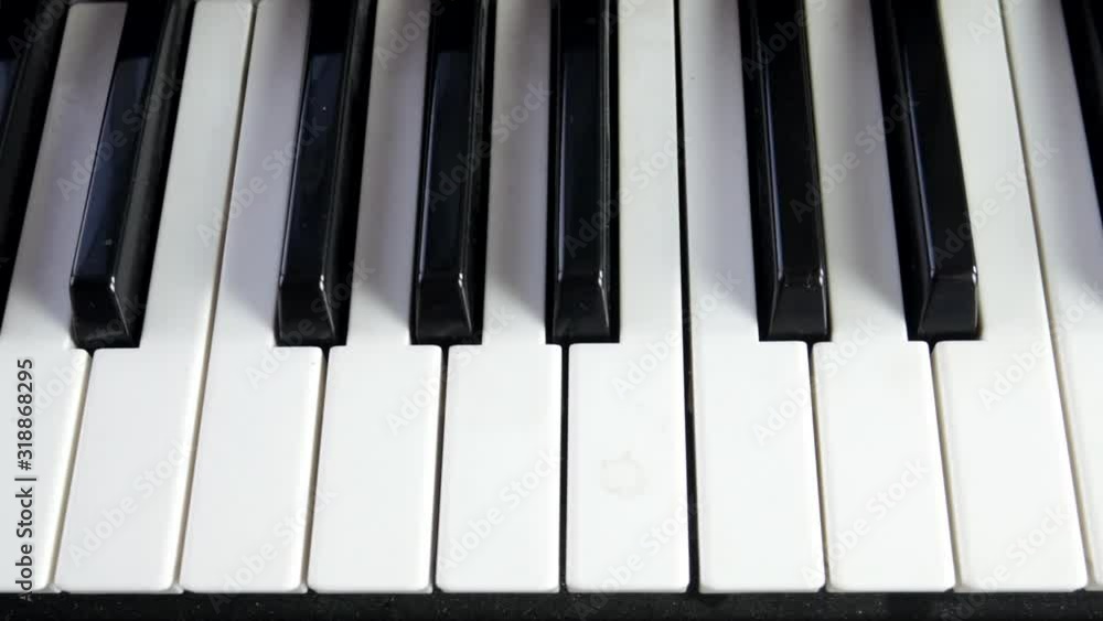 Piano keyboard slow panning over black and white keys Piano keyboard slow panning over black and white keys