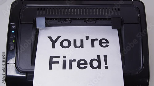 Close up getting Print of You're Fired on Paper from Printer 