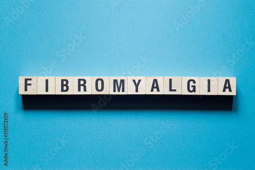Fibromyalgia word concept on cubes photo