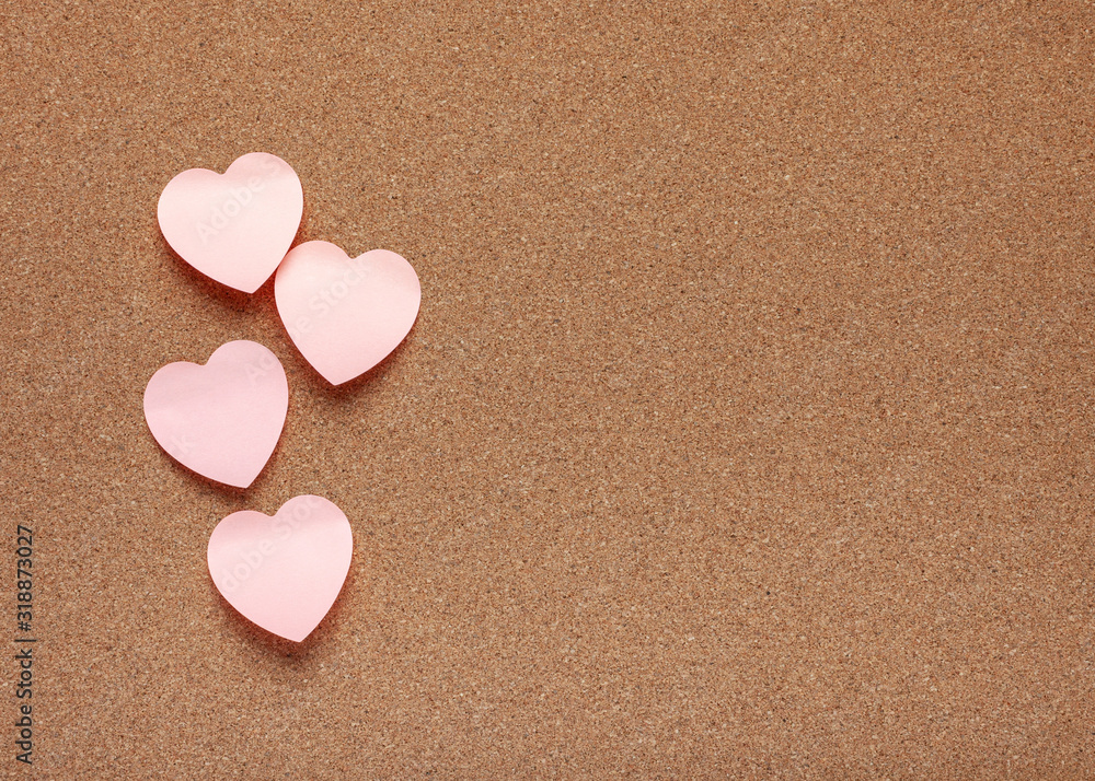 Cork board with heart stickers. Valentine's Day background. Cork board with heart stickers. Valentine's Day background.