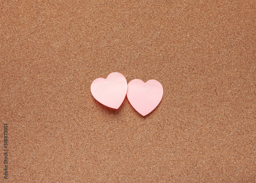 Obraz premium Cork board with heart stickers. Valentine's Day concept.