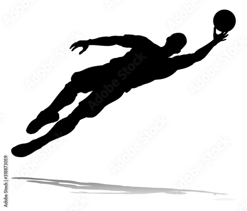 A soccer or football player in silhouette
