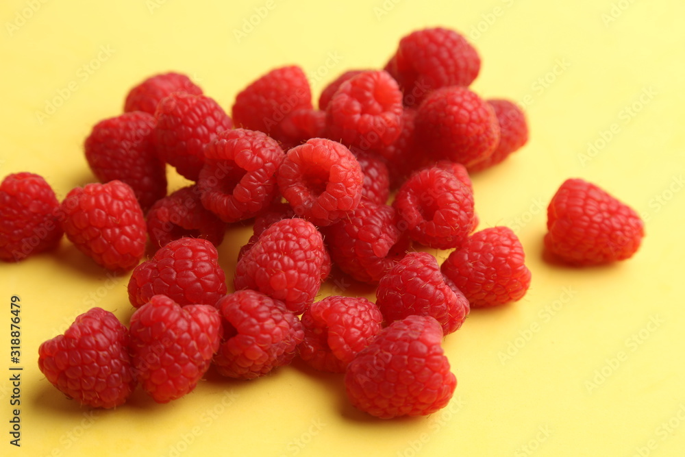 delicious raspberries in colorful background delicious raspberries in colorful background