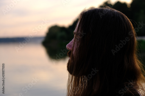 Tableau sur toile Portrait of handsome bearded young man with long hair